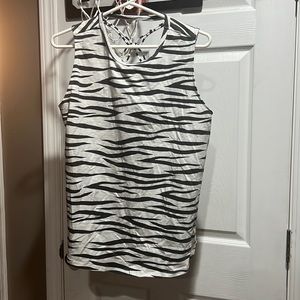 Zebra tank top. 94% cotton 2% rayonne 4% spandex